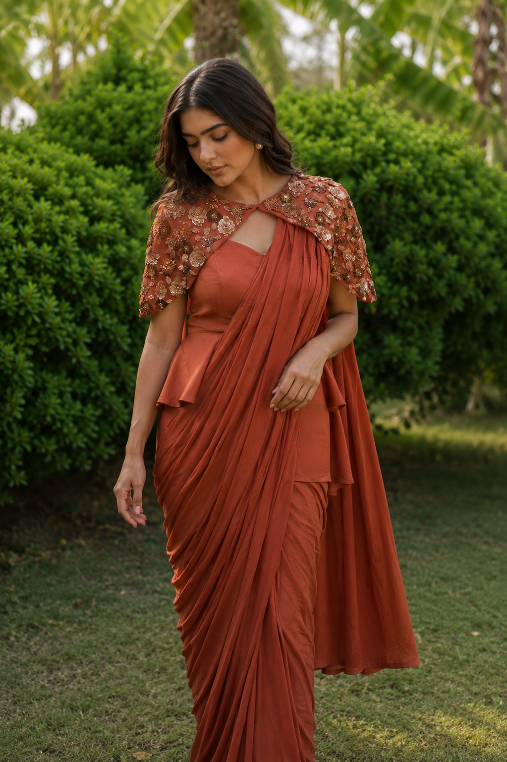 Rust Draped Saree With Statement Cape